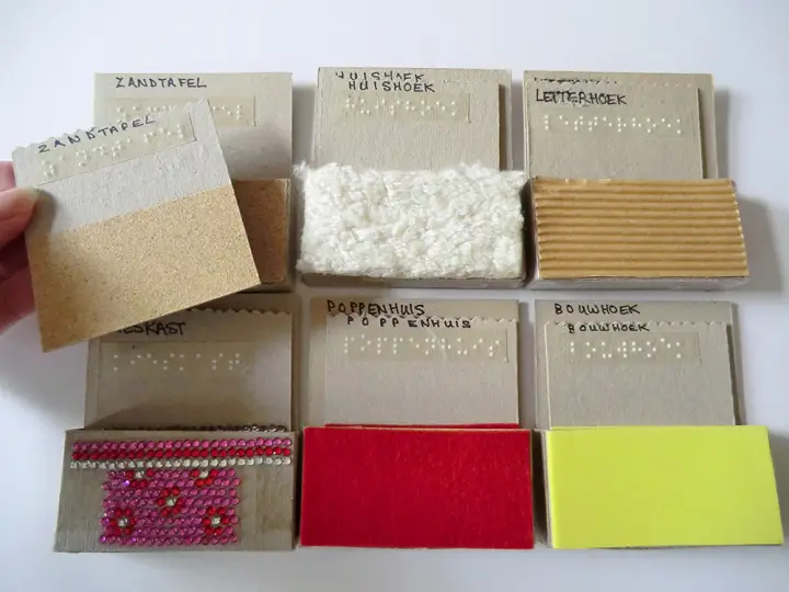 Activity cards with braille and tactile materials.